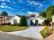 Well maintained single-story home with green lawn, driveway, and manicured landscaping at 17816 Se 115Th Ct, Summerfield, FL 34491