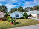 Well maintained home features manicured landscaping and paved driveway at 17816 Se 115Th Ct, Summerfield, FL 34491