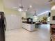 Bright kitchen featuring a view of the dining and living areas at 17816 Se 115Th Ct, Summerfield, FL 34491