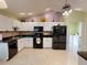 Modern kitchen equipped with updated appliances and stylish cabinetry at 17816 Se 115Th Ct, Summerfield, FL 34491