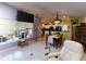Spacious living room with natural light, and open to dining and kitchen at 17816 Se 115Th Ct, Summerfield, FL 34491