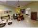 Comfortable living room with sofa, accent furniture and view to bedroom at 17816 Se 115Th Ct, Summerfield, FL 34491