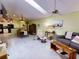 Open living space with ample seating, a ceiling fan, and natural light at 17816 Se 115Th Ct, Summerfield, FL 34491