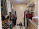 Walk-in closet with ample shelving for storage at 17816 Se 115Th Ct, Summerfield, FL 34491