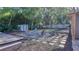 Inviting backyard with fire pit, mature trees, a hammock, and an entertainment deck at 1809 Pineview Cir, Winter Park, FL 32792