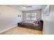 Comfortable bedroom featuring light fan, natural lighting, and wood-look flooring at 1809 Pineview Cir, Winter Park, FL 32792