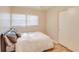 Bright bedroom featuring wood floors, closet, and comfortable bed with white bedspread at 1809 Pineview Cir, Winter Park, FL 32792