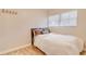 Bright bedroom featuring wood floors, natural light, and a comfortable bed with white bedspread at 1809 Pineview Cir, Winter Park, FL 32792