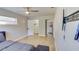Bedroom with closet, light fan, wood-look floors, and in-suite laundry at 1809 Pineview Cir, Winter Park, FL 32792
