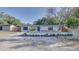 Charming single-story home featuring a well-maintained lawn and lush landscaping at 1809 Pineview Cir, Winter Park, FL 32792