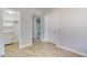 Hallway view with bath and closet access, featuring modern neutral paint and wood-look floors at 1809 Pineview Cir, Winter Park, FL 32792
