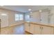 Bright kitchen featuring granite countertops, stainless steel appliances, and stylish white cabinetry at 1809 Pineview Cir, Winter Park, FL 32792