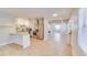 Bright, open kitchen featuring stainless steel appliances and a granite countertop breakfast bar at 1809 Pineview Cir, Winter Park, FL 32792