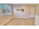 Bright room featuring wood floors, natural light, and doorway that leads to other rooms at 1809 Pineview Cir, Winter Park, FL 32792