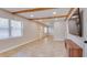 Spacious living room featuring natural light, wood trim, and tiled floors at 1809 Pineview Cir, Winter Park, FL 32792