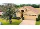 Charming one-story home with a well-maintained yard and attached two car garage at 19756 Glen Elm Way, Orlando, FL 32833