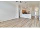 Inviting living room with wood-look flooring, open to the kitchen and dining areas at 19756 Glen Elm Way, Orlando, FL 32833