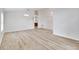 Spacious living room with modern wood-look floors, high ceilings, and neutral color palette at 19756 Glen Elm Way, Orlando, FL 32833