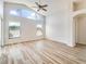 Bright living room with vaulted ceilings, large windows, and attractive wood-look flooring at 19756 Glen Elm Way, Orlando, FL 32833