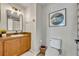 Traditional bathroom featuring a wooden vanity, and white toilet at 212 Belvedere Way, Sanford, FL 32773