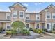 Charming two-story condo featuring a landscaped front yard and neutral colored stucco at 212 Belvedere Way, Sanford, FL 32773
