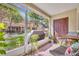 Relaxing screened patio with outdoor seating and a view of the lush green lawn at 212 Belvedere Way, Sanford, FL 32773