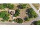 Aerial view of the property showcasing its well-maintained yard and proximity to the road at 21343 Reindeer Rd, Christmas, FL 32709