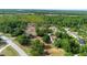Aerial view of a spacious residential property with lush surroundings and mature trees at 21343 Reindeer Rd, Christmas, FL 32709