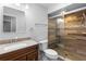 Updated bathroom featuring tile shower and granite vanity at 21343 Reindeer Rd, Christmas, FL 32709