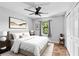 Cozy bedroom boasts natural light, hardwood floors, and a neutral color scheme, creating a serene retreat at 21343 Reindeer Rd, Christmas, FL 32709