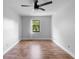 Bright bedroom with wood flooring, ceiling fan, natural light, and closet at 21343 Reindeer Rd, Christmas, FL 32709