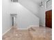 Inviting entryway with tile flooring, stairs, and front door at 21343 Reindeer Rd, Christmas, FL 32709