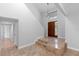 The tiled foyer features a decorative front door, stairway, and a hallway with doorways at 21343 Reindeer Rd, Christmas, FL 32709