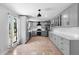 This eat-in kitchen features a new stainless steel appliance package, light grey cabinets, and white countertops at 21343 Reindeer Rd, Christmas, FL 32709