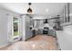 Spacious kitchen featuring stainless appliances, gray cabinetry, and lots of natural light at 21343 Reindeer Rd, Christmas, FL 32709