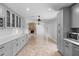 Updated kitchen with stone fireplace, stainless appliances, and gray cabinets at 21343 Reindeer Rd, Christmas, FL 32709