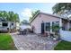 Backyard featuring a beautiful brick patio area, perfect for outdoor entertaining at 2305 S Magnolia Ave, Sanford, FL 32771