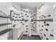 Modern bathroom featuring black and white tile shower, vanity and shelving at 2305 S Magnolia Ave, Sanford, FL 32771