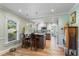 Beautiful eat-in kitchen featuring granite counters, stainless appliances, and wood floors at 2305 S Magnolia Ave, Sanford, FL 32771