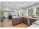 Modern kitchen with granite countertops, stainless steel appliances and view to living room at 2305 S Magnolia Ave, Sanford, FL 32771