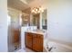 Well-lit bathroom featuring a glass shower, single vanity with ample counter space, and neutral colors at 23533 Valderama Ln, Sorrento, FL 32776