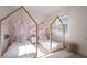 Charming bedroom featuring two whimsical house frame beds with matching white comforters and pink accents at 23533 Valderama Ln, Sorrento, FL 32776