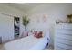 Comfortable bedroom featuring a plush bed, closet space, soft lighting, and a neutral color palette at 23533 Valderama Ln, Sorrento, FL 32776