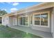 Spacious covered patio with fan, offering an outdoor space for relaxation and entertaining at 23533 Valderama Ln, Sorrento, FL 32776