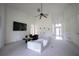 Spacious living room with high ceilings, a ceiling fan, and a cozy seating arrangement at 23533 Valderama Ln, Sorrento, FL 32776