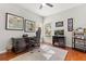 Bedroom with desk area, gaming chair and decor, natural light and neutral colored walls at 240 Promenade Cir, Lake Mary, FL 32746