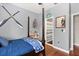 This is a cozy bedroom that includes a poster with a baseball theme and decor at 240 Promenade Cir, Lake Mary, FL 32746