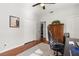 Bedroom featuring a work station, neutral walls, hardwood floors, closet and window at 240 Promenade Cir, Lake Mary, FL 32746