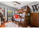 Bedroom with a bunk bed, dresser, hardwood floors, decor, window and neutral walls at 240 Promenade Cir, Lake Mary, FL 32746