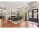 Elegant dining room featuring hardwood floors, tray ceiling, and a decorative chandelier at 240 Promenade Cir, Lake Mary, FL 32746